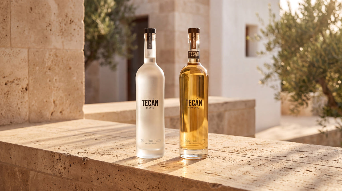 Tecán Blanco and Reposado in golden-hour light on travertine